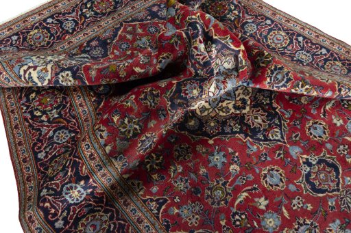 Surface texture of 2000s Kashan rug with natural Wool and intricate pattern