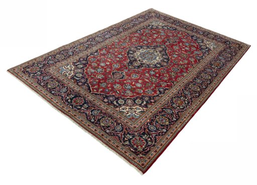 Corner detail of 2000s Kashan rug showing border pattern and Wool pile