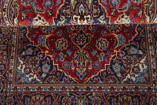 Close-up detail of 2000s Kashan rug from Iran / Persia showing Wool weave