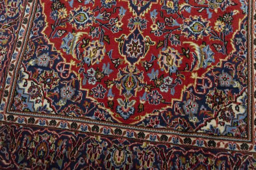 Close-up detail of 2000s Kashan rug from Iran / Persia showing Wool weave