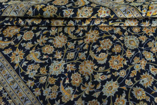 Close-up detail of 2000s Kashan rug from Iran / Persia showing Wool weave