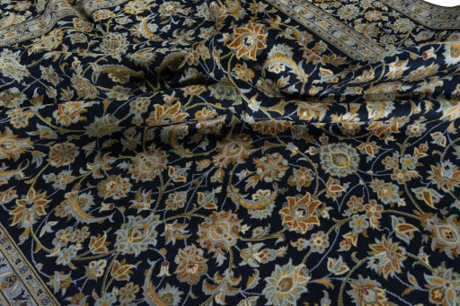 Surface texture of 2000s Kashan rug with natural Wool and intricate pattern