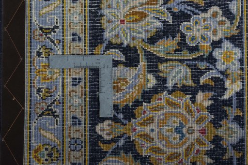 Close-up detail of 2000s Kashan rug from Iran / Persia showing Wool weave