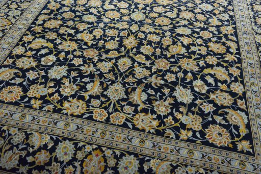 Close-up detail of 2000s Kashan rug from Iran / Persia showing Wool weave