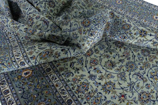 Surface texture of 2000s Kashan rug with natural Wool and intricate pattern