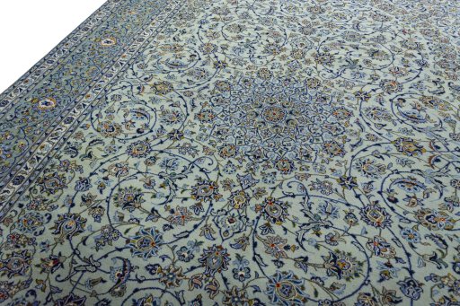Backside of handmade 2000s Kashan rug showing knot structure and weave density
