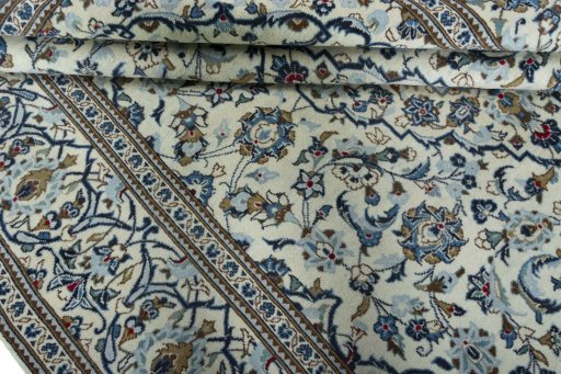 Close-up detail of 2000s Kashan rug from Iran / Persia showing Wool weave