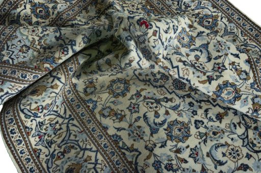 Surface texture of 2000s Kashan rug with natural Wool and intricate pattern