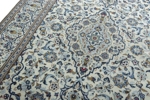 Backside of handmade 2000s Kashan rug showing knot structure and weave density