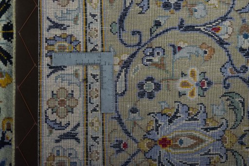 Backside of handmade 2000s Kashan rug showing knot structure and weave density