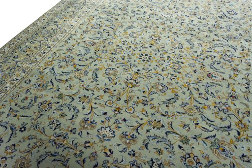 Backside of handmade 2000s Kashan rug showing knot structure and weave density