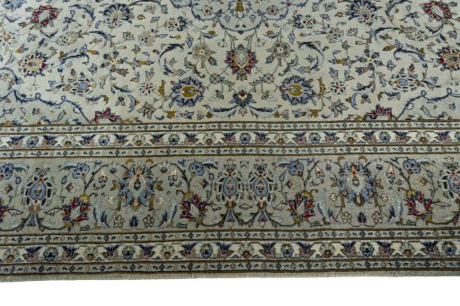 Corner detail of 2000s Kashan rug showing border pattern and Wool pile