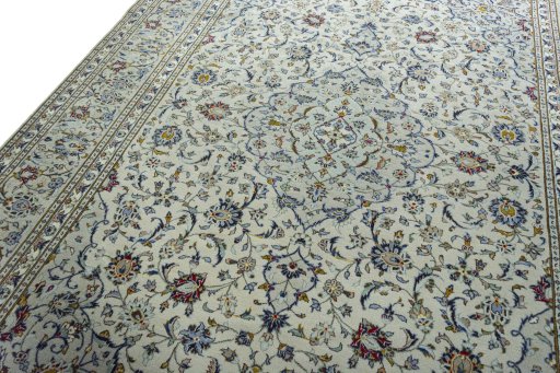 Backside of handmade 2000s Kashan rug showing knot structure and weave density