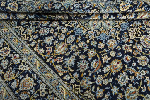 Close-up detail of 2000s Kashan rug from Iran / Persia showing Wool weave