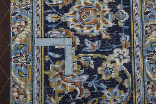Backside of handmade 2000s Kashan rug showing knot structure and weave density