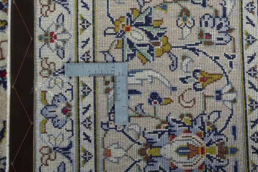 Backside of handmade 2000s Kashan rug showing knot structure and weave density