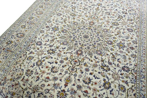 Backside of handmade 2000s Kashan rug showing knot structure and weave density