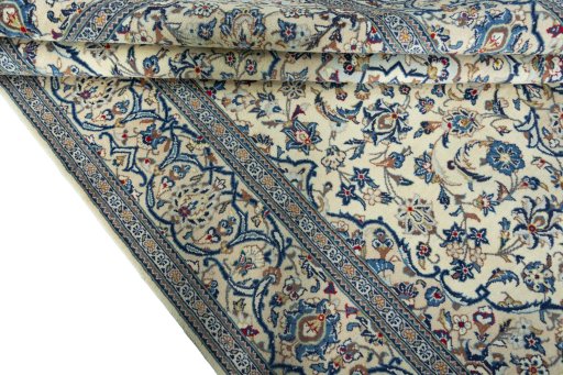 Close-up detail of 2000s Kashan rug from Iran / Persia showing Wool weave