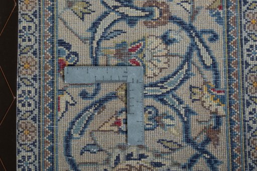 Backside of handmade 2000s Kashan rug showing knot structure and weave density