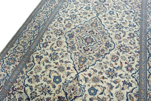 Backside of handmade 2000s Kashan rug showing knot structure and weave density