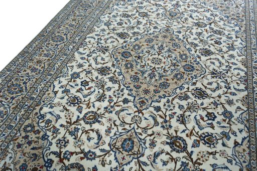 Backside of handmade 2000s Kashan rug showing knot structure and weave density