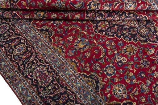 Close-up detail of 2000s Kashan rug from Iran / Persia showing Wool weave