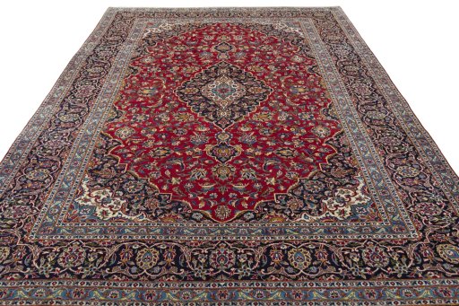 Surface texture of 2000s Kashan rug with natural Wool and intricate pattern