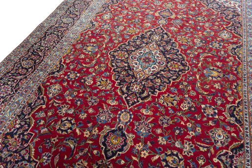 Backside of handmade 2000s Kashan rug showing knot structure and weave density