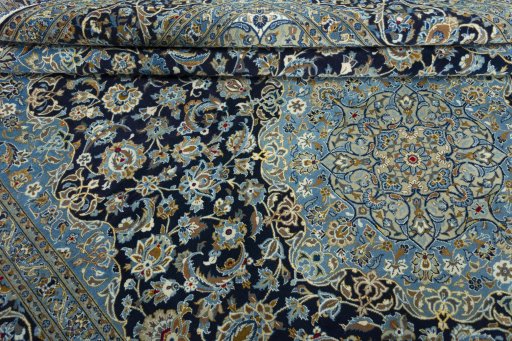 Close-up detail of 2000s Kashan rug from Iran / Persia showing Wool weave