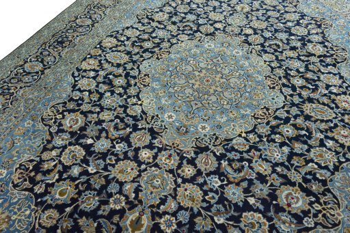 Backside of handmade 2000s Kashan rug showing knot structure and weave density