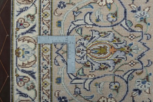 Backside of handmade 2000s Kashan rug showing knot structure and weave density