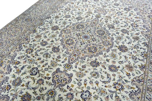 Backside of handmade 2000s Kashan rug showing knot structure and weave density