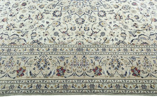 Corner detail of 2000s Kashan rug showing border pattern and Wool pile