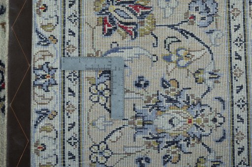 Backside of handmade 2000s Kashan rug showing knot structure and weave density