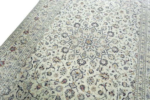 Backside of handmade 2000s Kashan rug showing knot structure and weave density