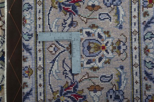 Backside of handmade 2000s Kashan rug showing knot structure and weave density