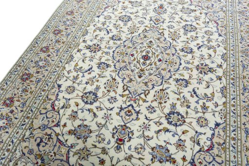Backside of handmade 2000s Kashan rug showing knot structure and weave density