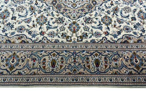 Corner detail of 2000s Kashan rug showing border pattern and Wool pile