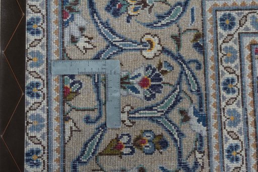 Backside of handmade 2000s Kashan rug showing knot structure and weave density