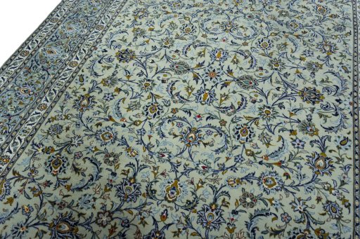 Backside of handmade 2000s Kashan rug showing knot structure and weave density