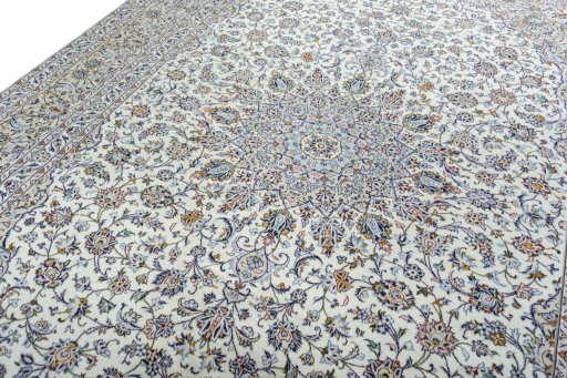 Backside of handmade 2000s Kashan rug showing knot structure and weave density