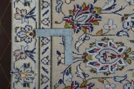 Backside of handmade 2000s Kashan rug showing knot structure and weave density