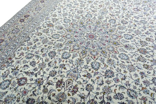 Backside of handmade 2000s Kashan rug showing knot structure and weave density