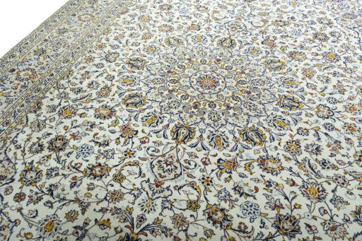 Backside of handmade 2000s Kashan rug showing knot structure and weave density