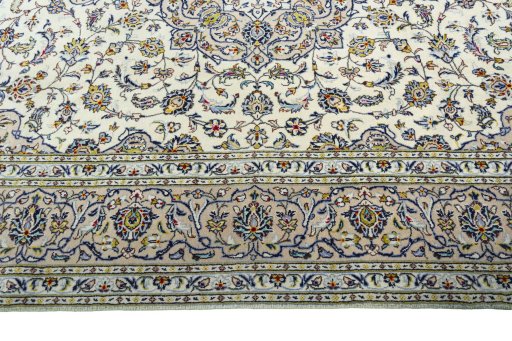 Corner detail of 2000s Kashan rug showing border pattern and Wool pile