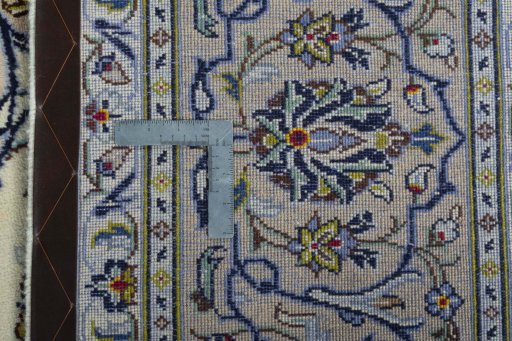 Backside of handmade 2000s Kashan rug showing knot structure and weave density