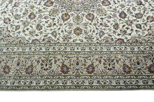 Corner detail of 2000s Kashan rug showing border pattern and Wool pile