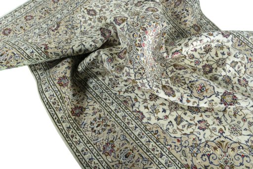 Surface texture of 2000s Kashan rug with natural Wool and intricate pattern