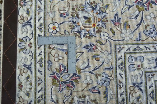 Backside of handmade 2000s Kashan rug showing knot structure and weave density