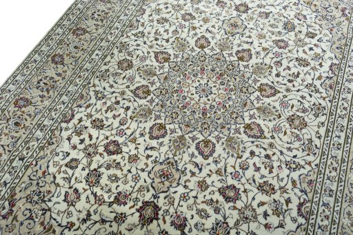 Backside of handmade 2000s Kashan rug showing knot structure and weave density